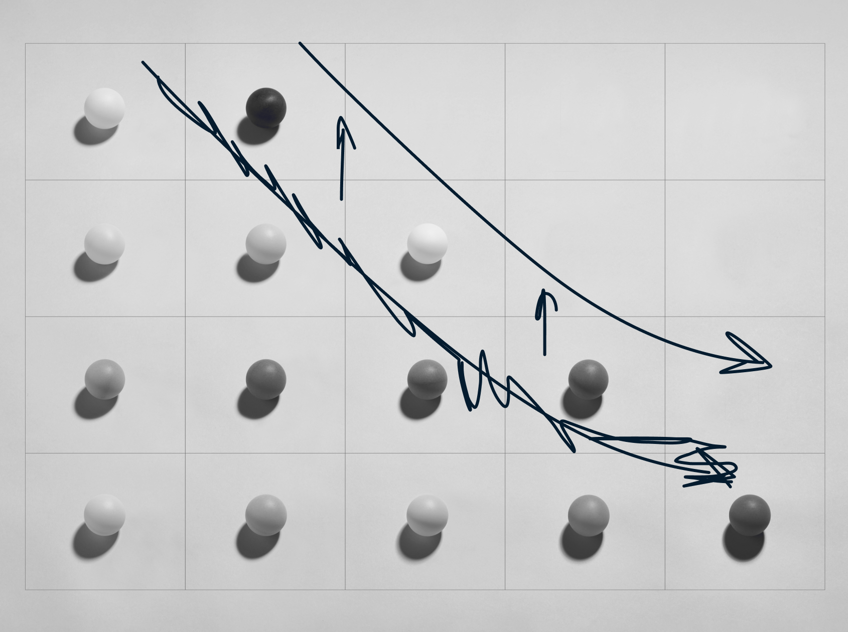 A 5x5 grid with white, gray, and one black spherical objects. Blue arrows drawn diagonally across the grid, indicating a descending path.